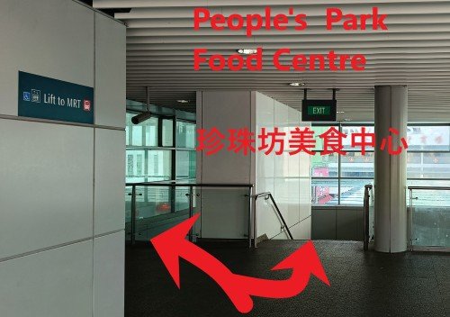 Cross the bridge and either take the lift or walk down the stairs on the right to the ground level.