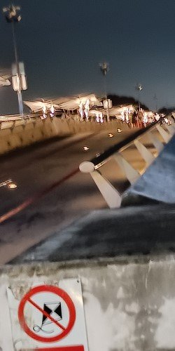 Walk away from the Marina Barrage Dam and Bridge.