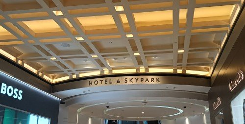 Follow Hotel & SkyPark sign at B2M underpass.