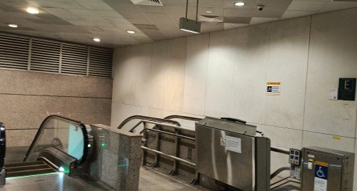 Go down the escalator at Exit E.