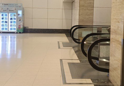 Turn right and go up the escalator.