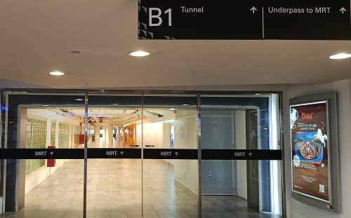 Walk straight pass the glass doors to the underpass to the MRT.