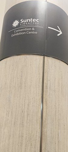 Walk straight, turn right at the first corner and continue walking until you see the sign and then turn right and exit the building.