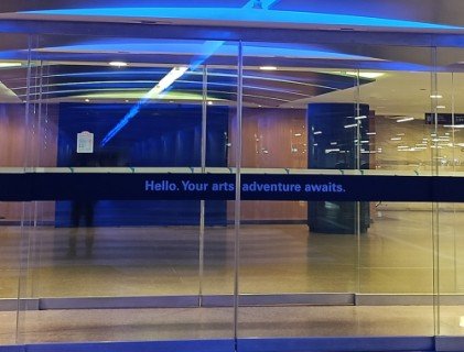 Go through the glass doors on your left into Esplanade Theatres.