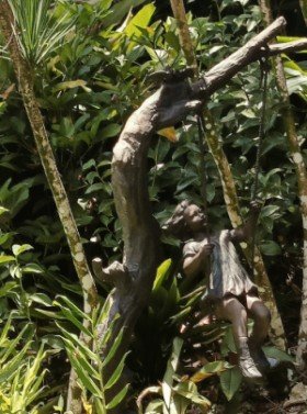 Little Girl Swinging on Tree by Unknown Sculptor.