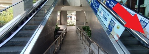 Turn right and go down the escalator.