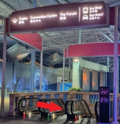 Go down the escalator.