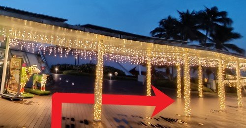 Turn right at the sheltered walkway and walk along the sheltered walkway.