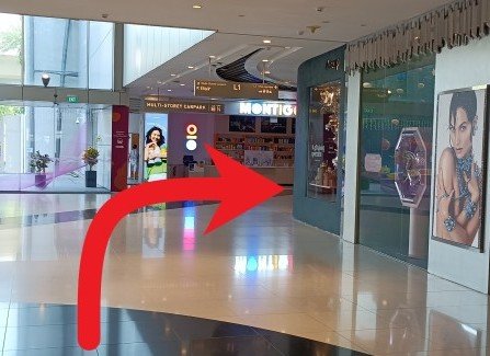 Turn right at the corner and continue walking.