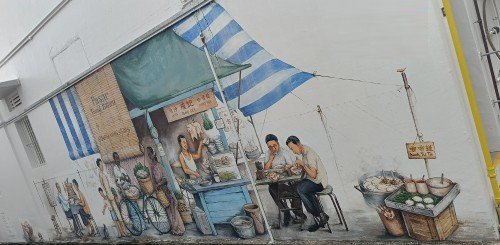 叶耀宗创作的巴刹和算命先生壁画。